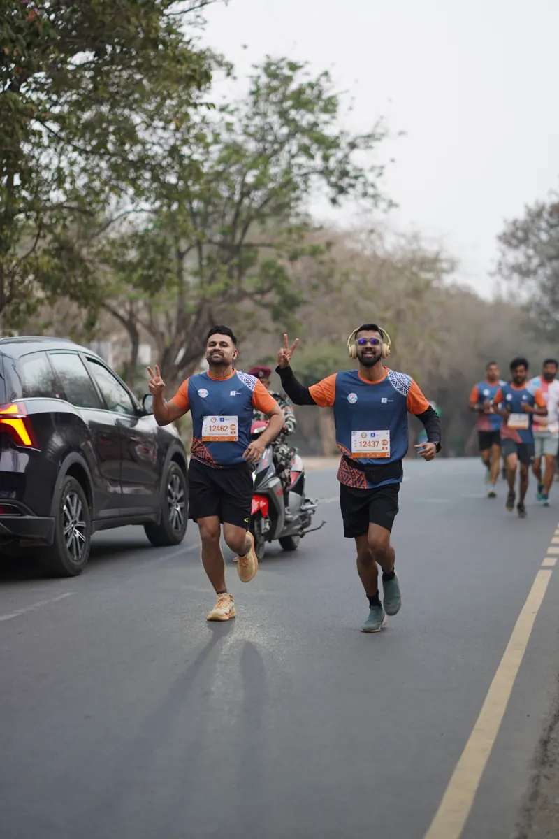 Two runners on the open road early in the 10K