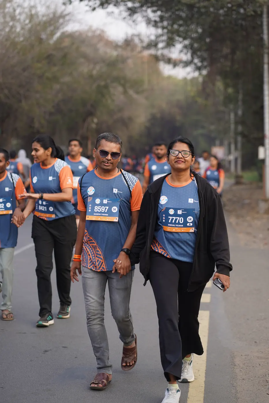 Friends walking the course together in Run InSync T-shirts
